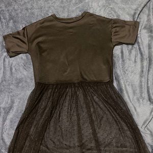 Black shirt with skirt attached to it